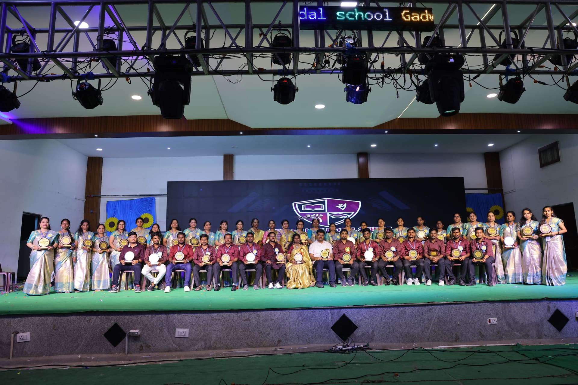 Staff receiving awards at the Annual Day ceremony