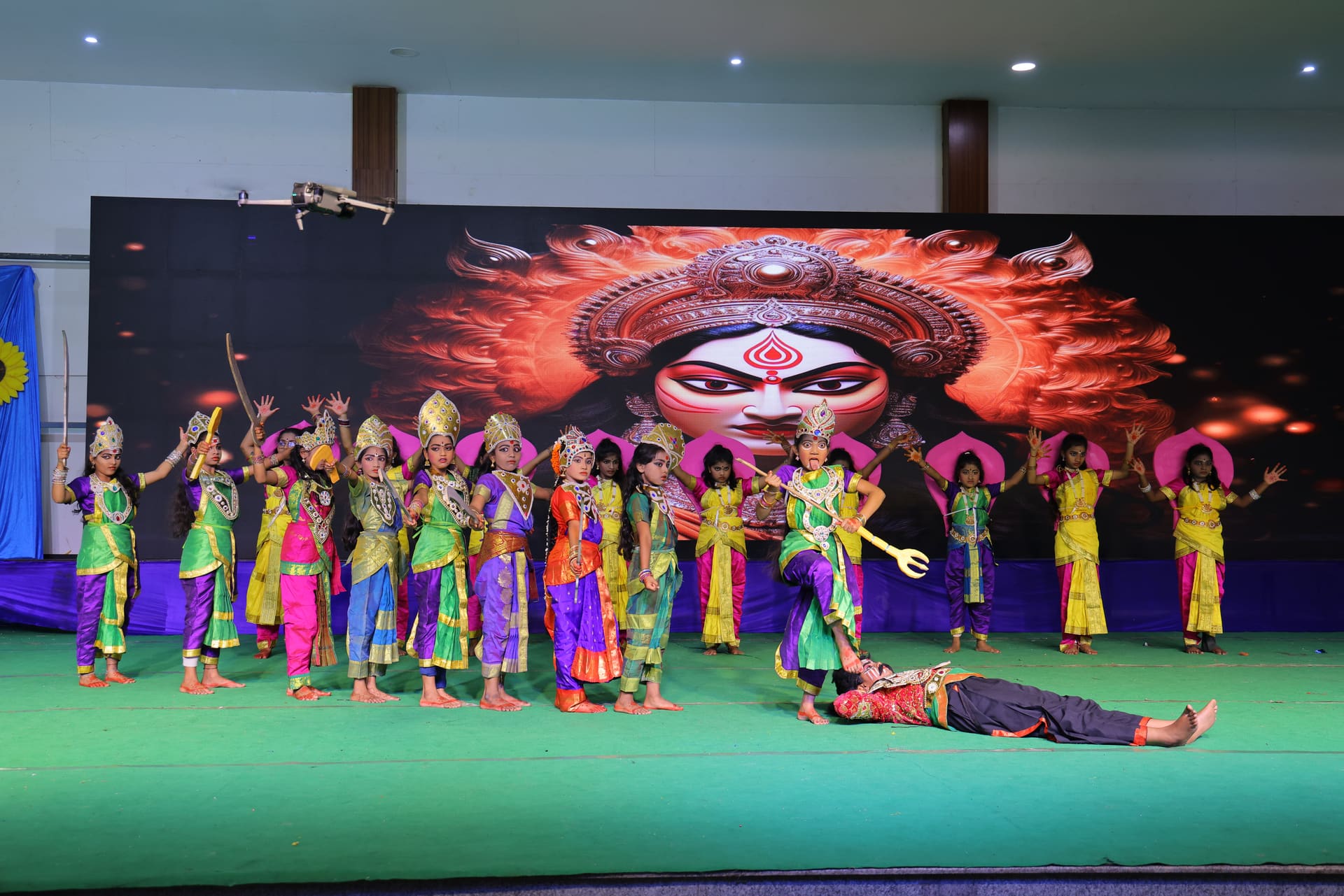 Students performing a cultural dance on stage